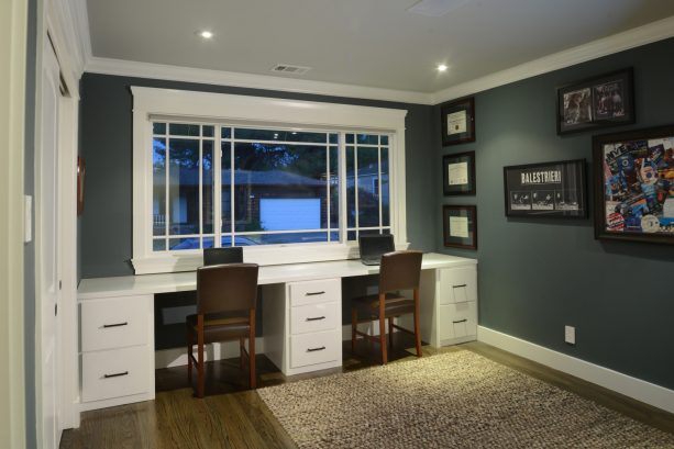 a craftsman home office with window casing and simple crown molding