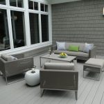 a dark grey shingle siding paired with a light grey deck