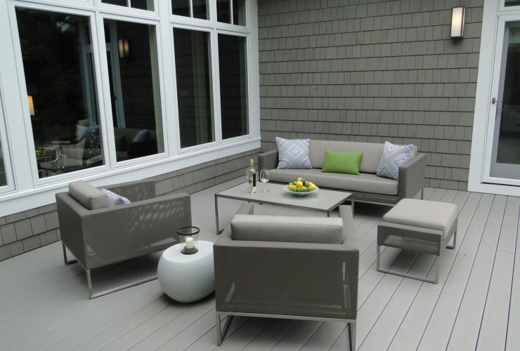 a dark grey shingle siding paired with a light grey deck