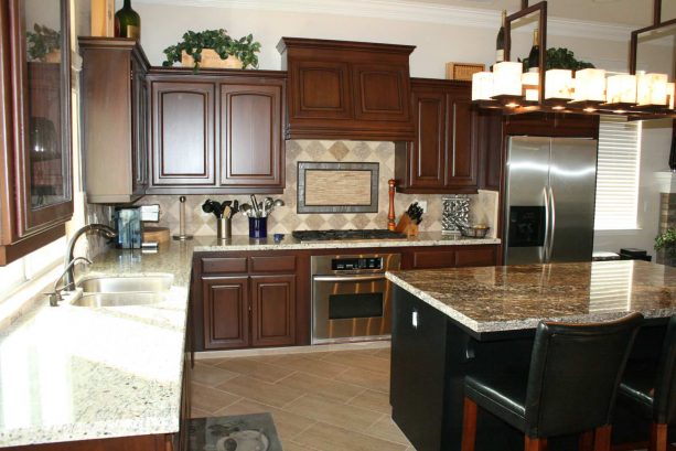 a neater look after the oak cabinets get a raised-panel and staining update