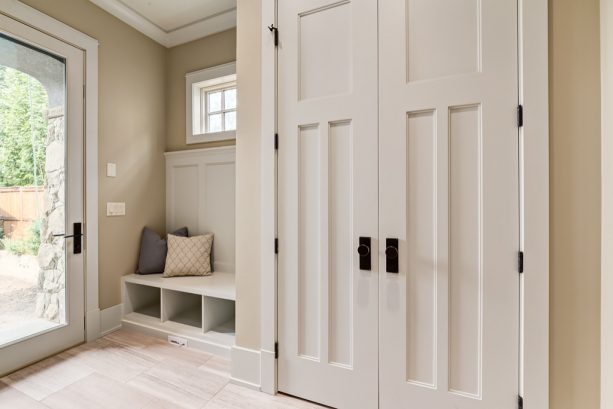 custom mudroom bench and crown molding in a craftsman entry