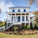 a lace-white siding paired with grey trim in a traditional exterior