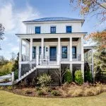 a lace-white siding paired with grey trim in a traditional exterior