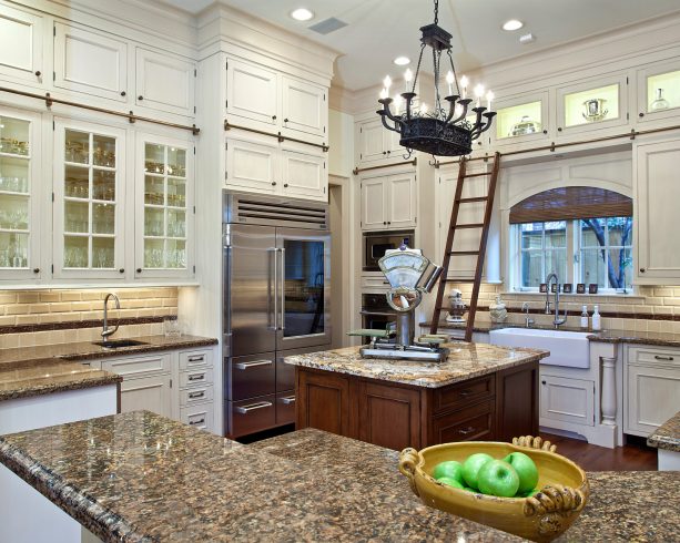 antique white kitchen cabinets paired with copper brown granite countertops