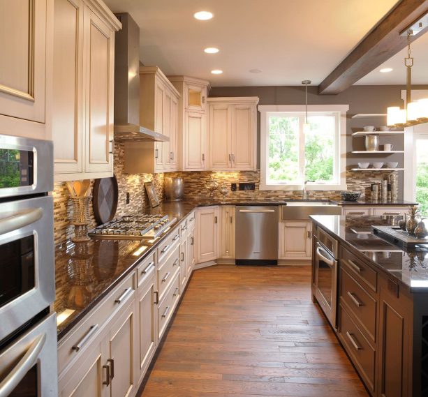 base, wall, and island cabinets with brown granite countertops in a traditional kitchen