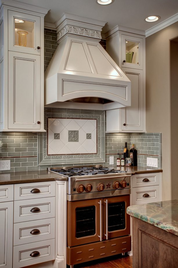gorgeous combination of brown oven-stove, brown countertops, and white cabinets