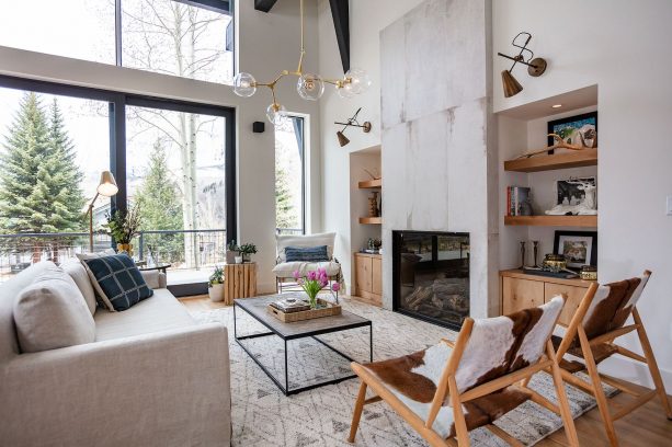 a farmhouse interior with black iron frame, wood top table and other industrial accents