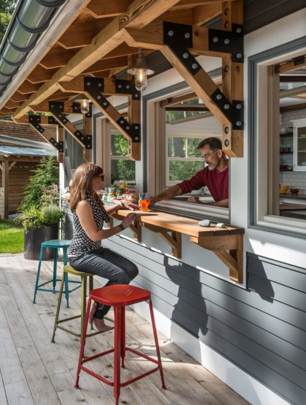 a pass through window looks beautiful with a custom wooden counter