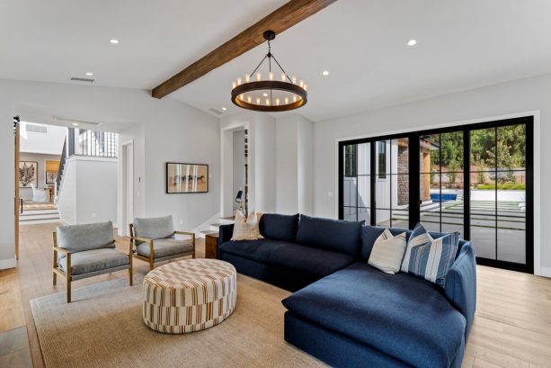 the iconic round hanging chandelier for adding a prominent industrial touch in a farmhouse living room