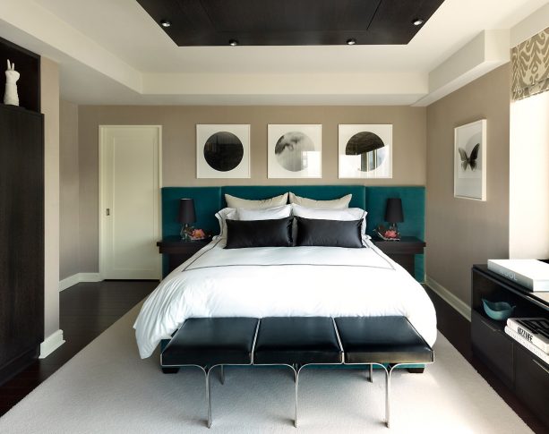 a contemporary velvet bed looks accentuating with its teal color that is pair with the black furniture