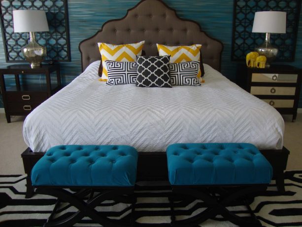 a pair of gorgeous tufted ottomans in a bedroom with teal and black contemporary-style