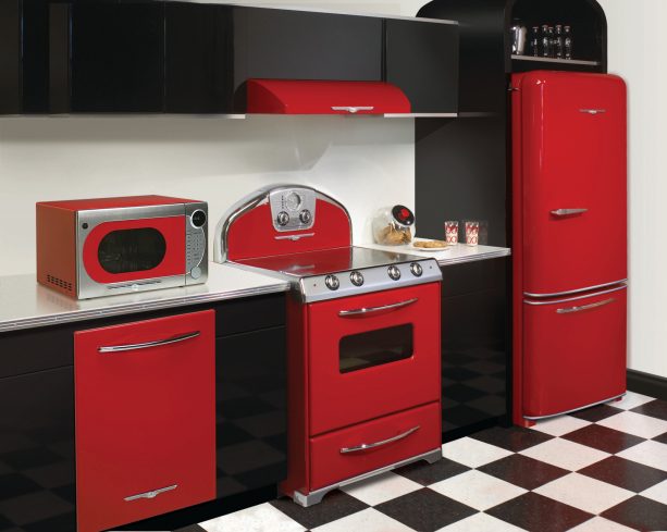 a set of red retro appliances for easy decorating in a black and white kitchen interior