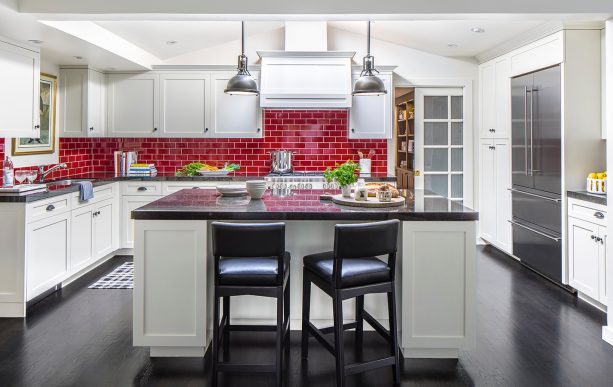 another view of the kitchen showing how stunning the red subway tile backsplash looks