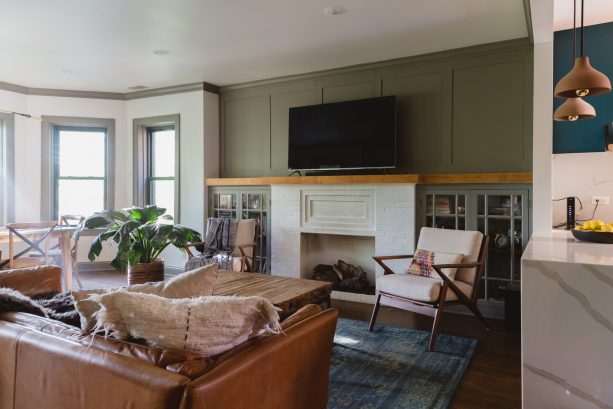 a neater look is obtained when the fireplace is paired with bookshelves with doors