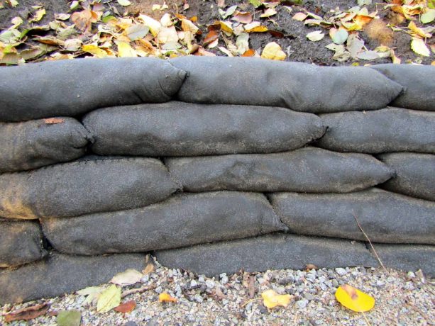 an image of concrete retaining wall after the bags are degraded after some time