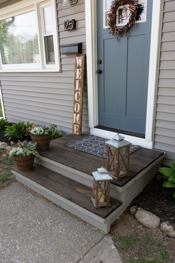 concrete front steps gain a new look after getting some wood panels installed on top of it