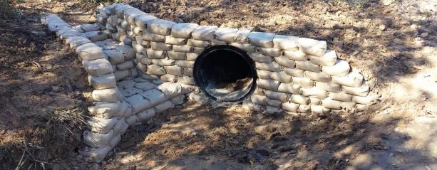 steps and water tunnel retaining wall project with concrete bags