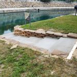 the combination of steps and concrete bags retaining walls in a riverside