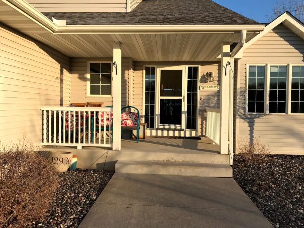 the concrete steps and front porch before the makeover is done