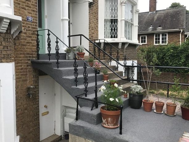 the repairing and resurfacing process of the front concrete steps using plaster mortar