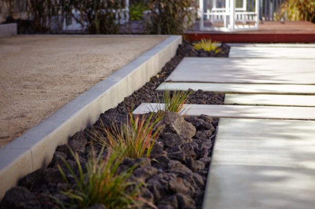 a closer look with the black lava rock and red and green grass