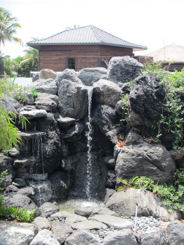 natural-looking fountain from large black lava rocks
