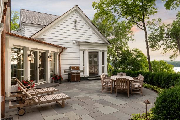 the back patio accessible through the garage covered walkway