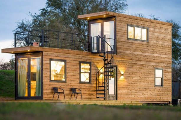 a fabulous two-bedroom tiny house with two bedroom and a deck on the second floor