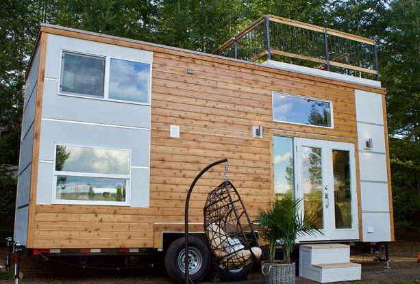 a multitone tiny house exterior with roof deck at the top