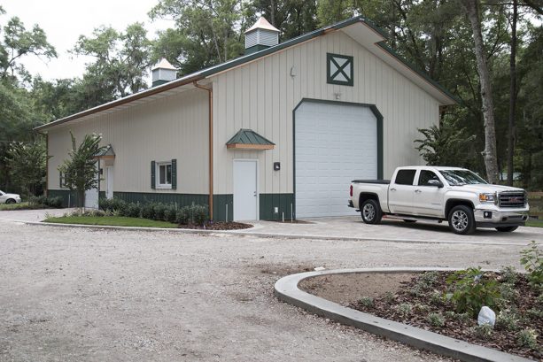 a pole barn comes with gorgeous green and antique white exterior