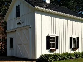 a pole barn garage completed with loft for workspace