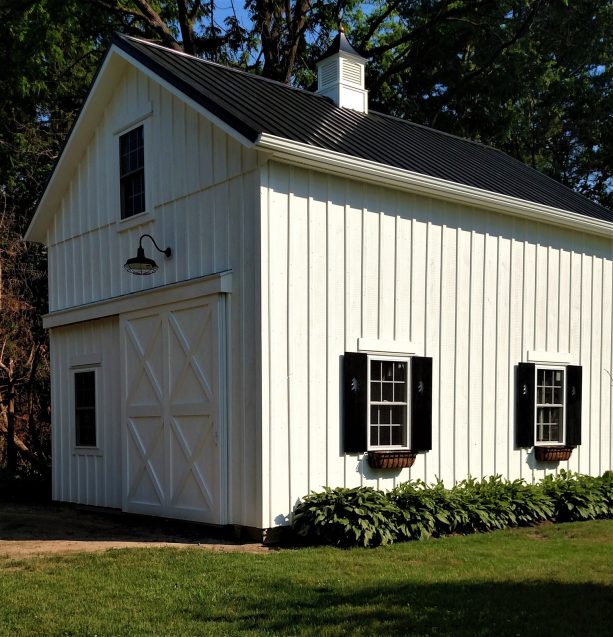 a pole barn garage completed with loft for workspace