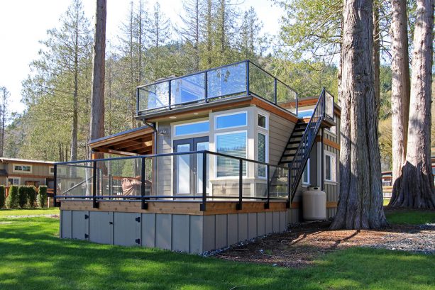 the black metal stair with rail to access the roof deck of the tiny house