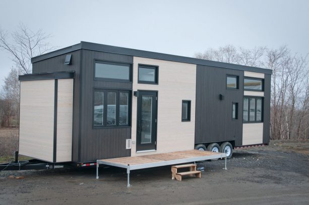 the exterior of this Magnolia XL tiny house does not show that it has a roof deck