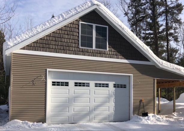 the look of the premium pole barn from outside with windows for the loft