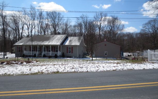 the pole barn workshop is located beside the main house