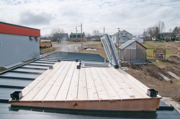 the simple deck without rail is accessible through an openable skylight