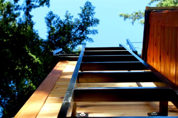 the simple metal stair used to access the roof deck