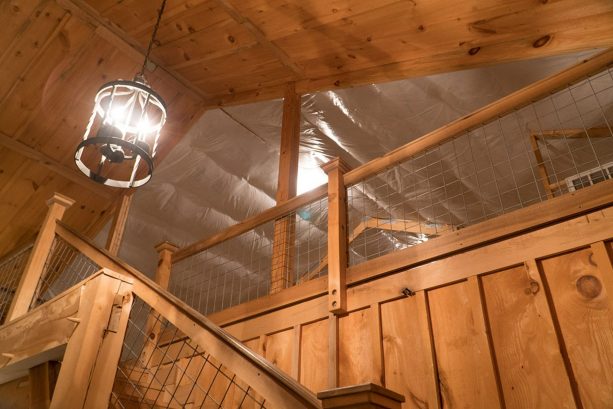 the staircase and wire railing of the loft