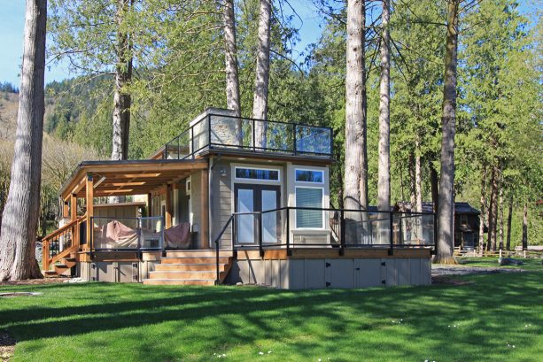 the tiny craftsman house with decks and roof extensions