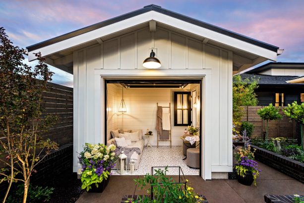 a small farmhouse shed with sectional garage door functioned as a guest room