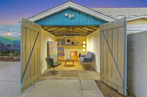 an art studio shed with double-opening, Z-bar style garage door
