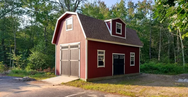 barn-style homestead two-story storage shed with standard garage door