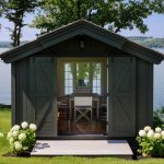 greyish brown writing and workshop studio shed with double sliding door garage door