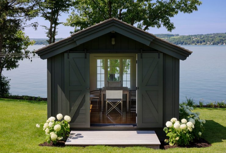 greyish brown writing and workshop studio shed with double sliding door garage door