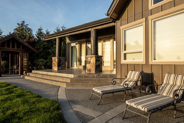 loungers make a concrete patio with exposed aggregate excellent for enjoying the sun