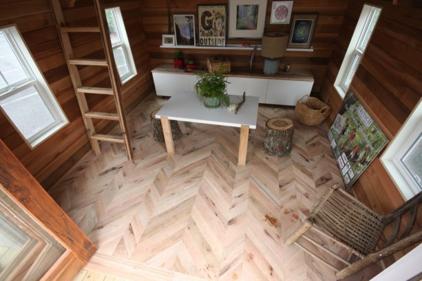 the living area with stylish herringbone floor