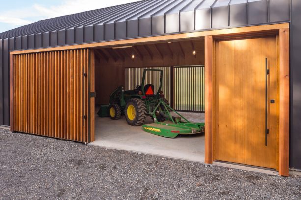 the sliding garage entrance is completed with a man door too