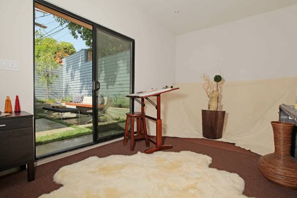 the sliding glass door at the very back part of the studio shed