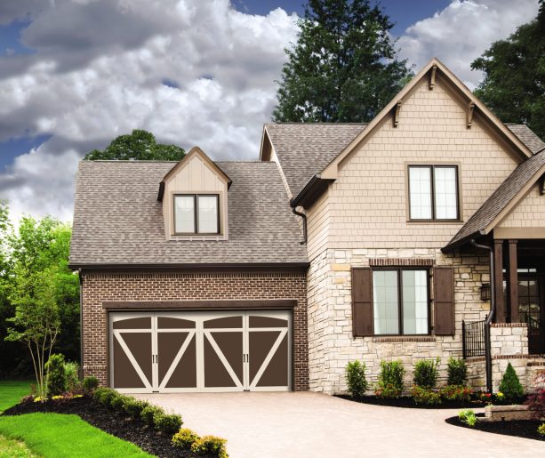 a cozy exterior with steel garage doors that look like wood